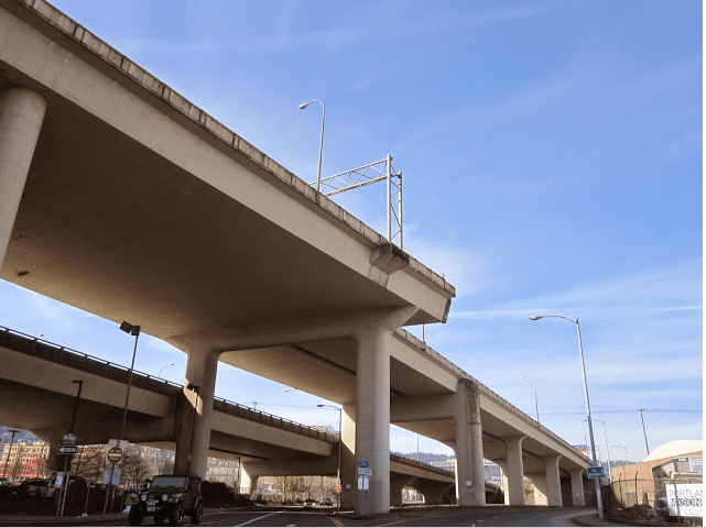 The freeway "chad"/ghost ramp is just north of St. Patrick's Church. The picture show a functioning ramps and a stump of a ramp -taken on a day with bright blue skys This was once going to connect the Fremont Bridge to I505. (Image TLM March 2015)
