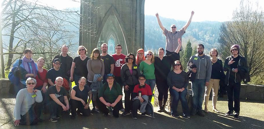 Tour group in front of St. Johns Bridge. Twenty-one guests and one guide. This was staff from the local New Seasons store.