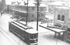 Image on a street car going south passing the Esquire Theater on snowy day on NW 23rd & kerney