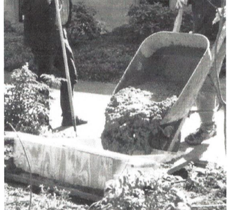 Text "Designer John Laursen supervises pouring at the Hazel Hall Memorial on NW 22nd Place in 1995.