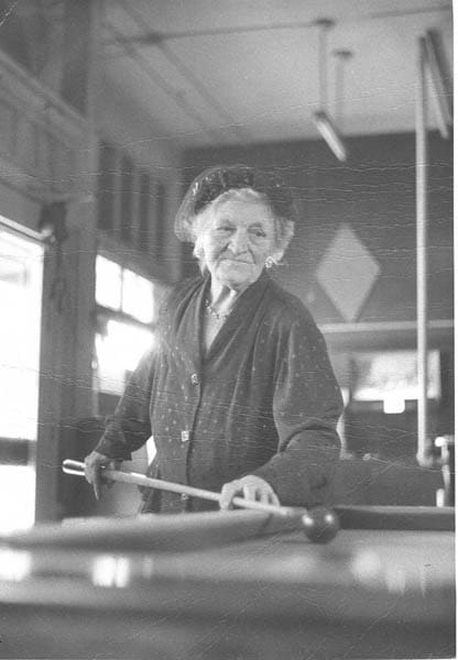 Myrtle Casper Playing Pool she looks like a story book tiny grandmother taking a shot at Tavern and Pool