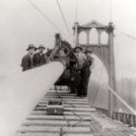 Historical photo of the St Johns Bridge under construction"