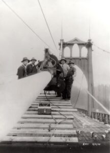 Five men building the St. Johns Bridge cable equipment and tool box. Date written on photo 4/2/31