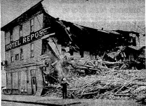 Half demolished three story wood frame building