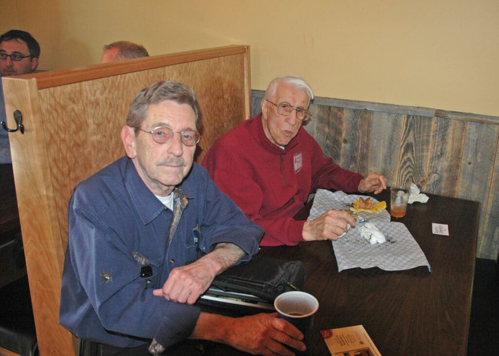 Vince Peveskovich Mike Ryerson sittong at a booth at a bar