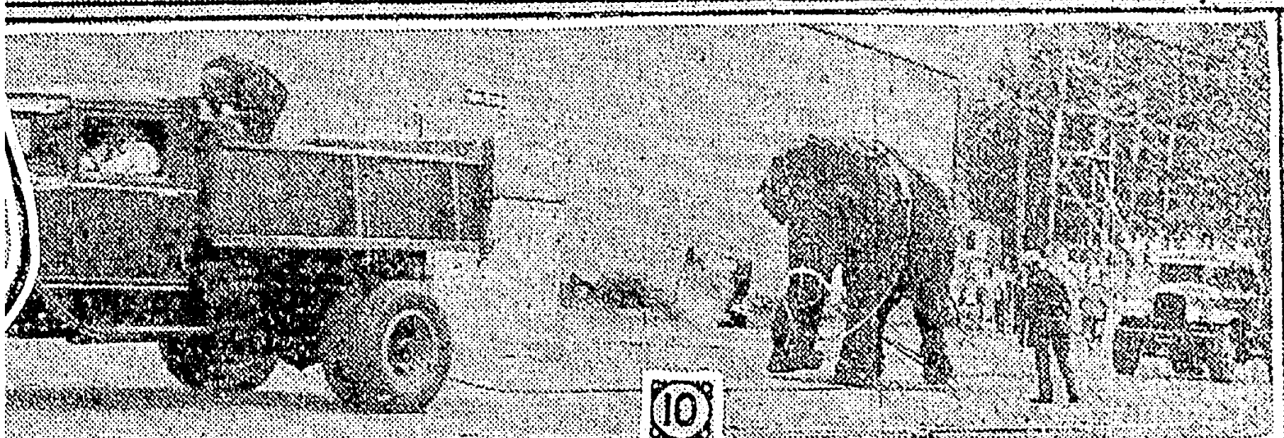 Image of Tusko in the Rose Festival super low quality from a newspaper article that was zoomed in just to see Tusko toed to the dump trucks