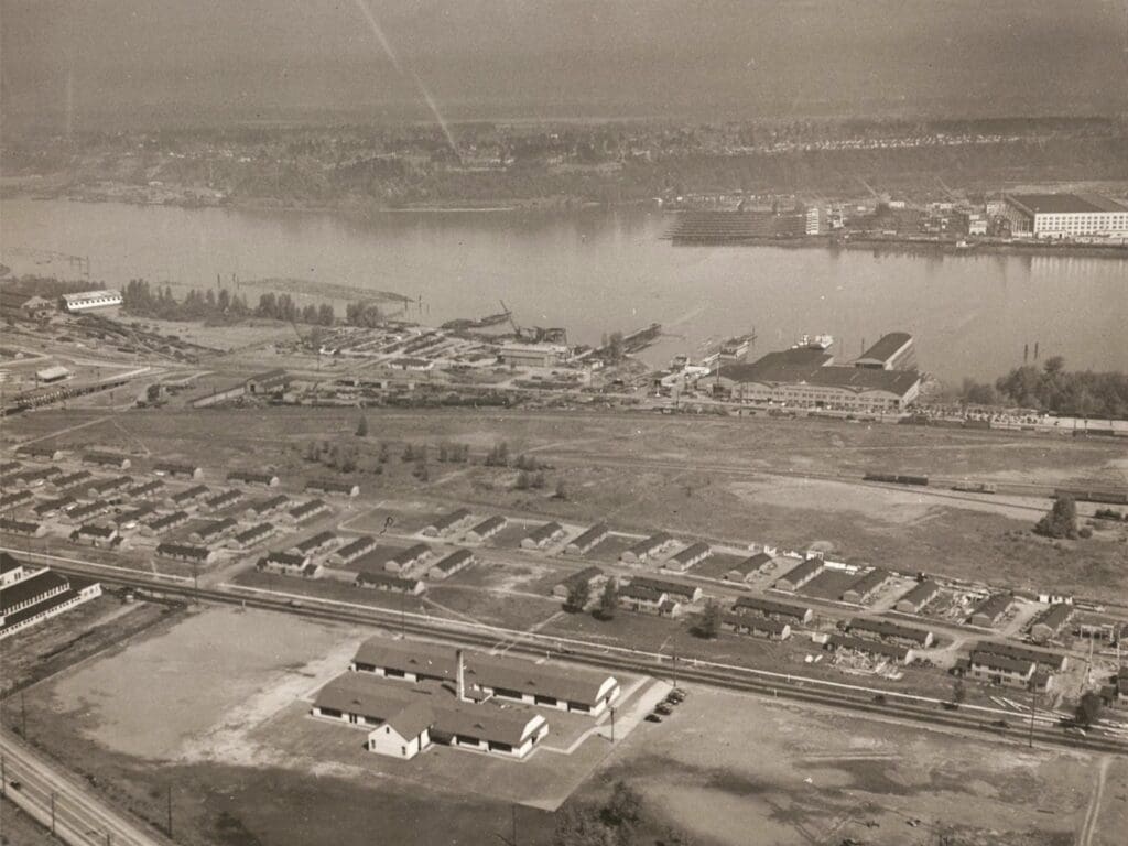 Ariel Image Willamette River is at the top, 100s of units of 1942 Defense housing a H-shaped public school DSt. Helens Riad and Yeon are in the shot but the intersection of that and Kitridge are just out of view on the left