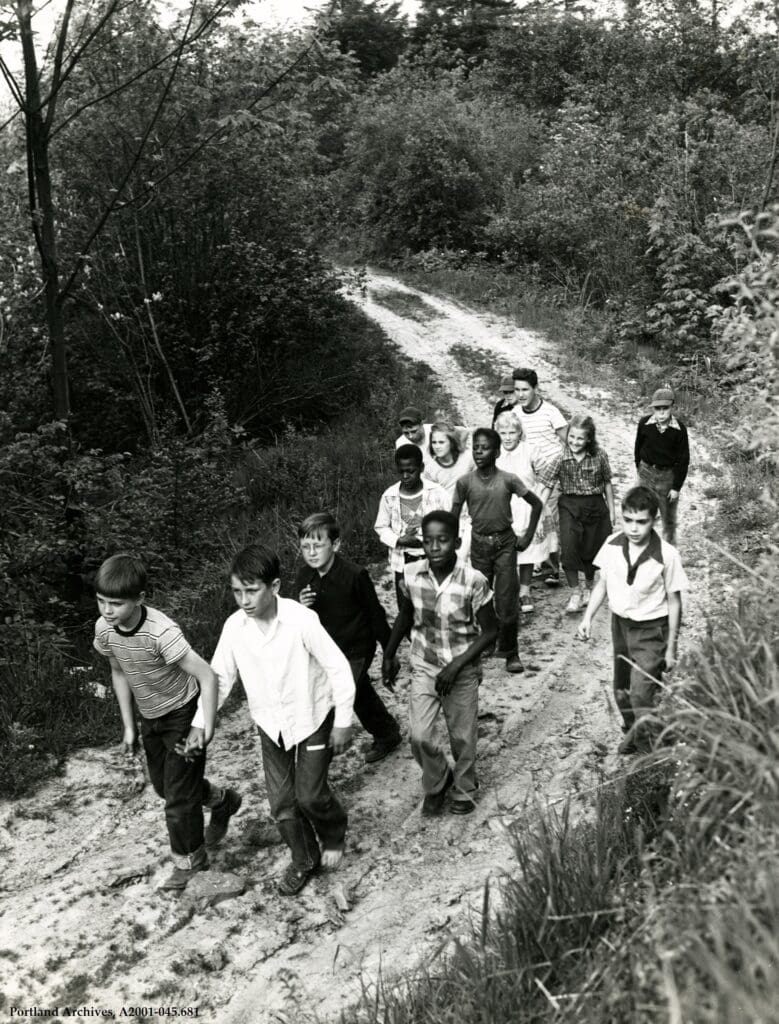 Mixed Race Group of about a dozen children approx. ages 10 on a dirt trail