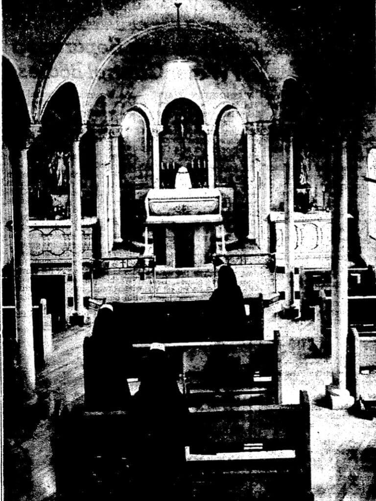 Grainy image of the St. Mary's chapel in SW Portland (demolished now) photographer might have stoofd on a ladder to get the looking down from the back of the church alter in the far ground